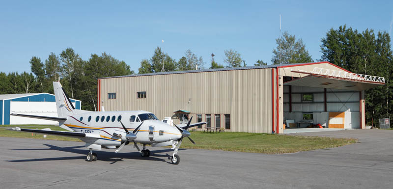 Plane coming out of the hangar